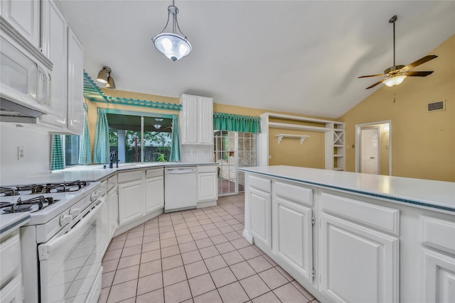 4214 Hambledon Village Dr, Houston, TX 77014 - kitchen with white appliances, ceiling fan, lofted ceiling, light countertops, and white cabinets