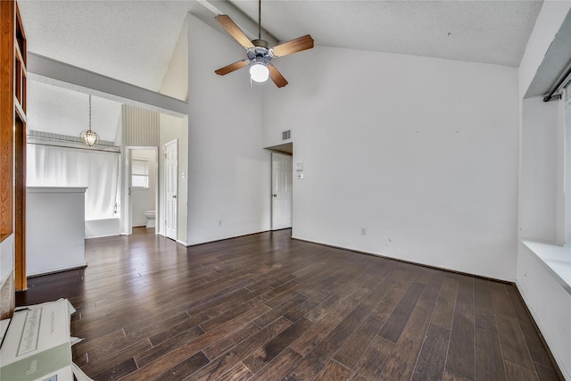 4214 Hambledon Village Dr, Houston, TX 77014 - unfurnished living room with ceiling fan, wood finished floors, high vaulted ceiling, and a textured ceiling