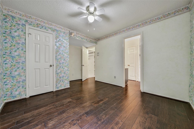 4214 Hambledon Village Dr, Houston, TX 77014 - unfurnished room featuring wood finished floors, a textured ceiling, ceiling fan, wallpapered walls, and baseboards