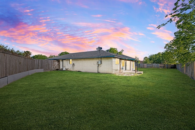 10431 Sagewillow Ln, Houston, TX 77089 - back of property at dusk with brick siding and a patio area