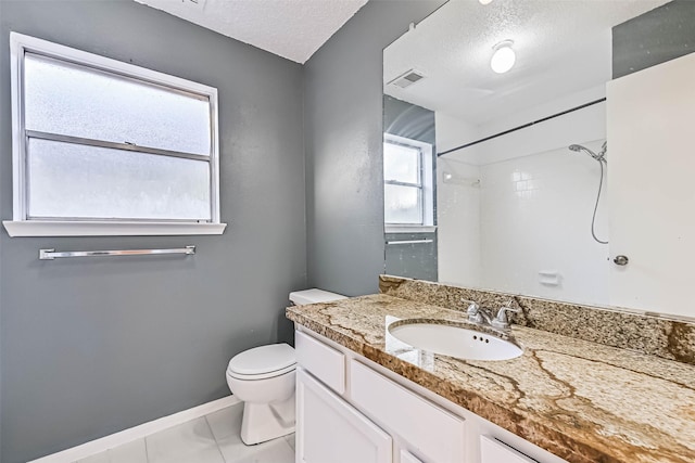 3419 Gladwyne Ln, La Porte, TX 77571 - full bathroom featuring toilet, a shower, vanity, a textured ceiling, and baseboards