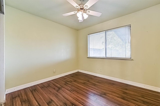 3419 Gladwyne Ln, La Porte, TX 77571 - empty room featuring baseboards, dark wood-type flooring, and a ceiling fan