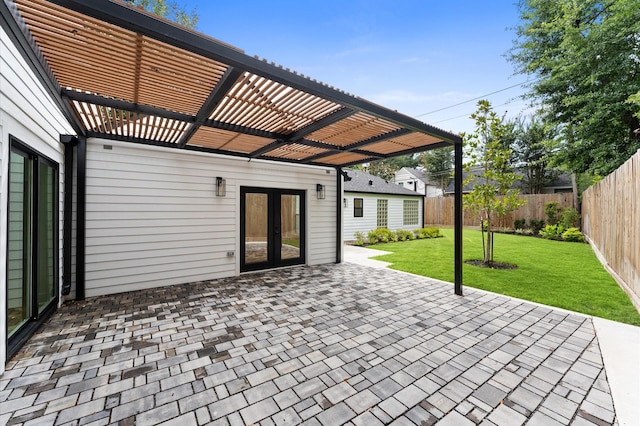 1100 S Shepherd Dr, Houston, TX 77019 - fenced backyard with french doors, a pergola, and a patio area