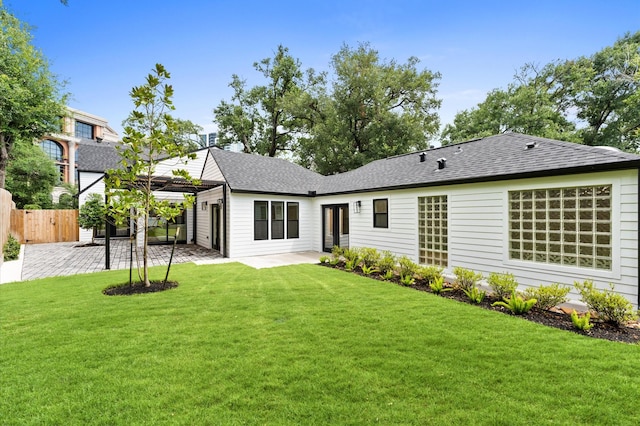 1100 S Shepherd Dr, Houston, TX 77019 - back of property featuring a patio area and roof with shingles