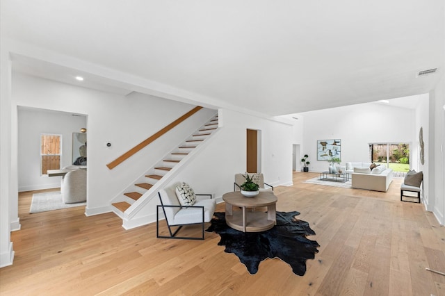 1100 S Shepherd Dr, Houston, TX 77019 - sitting room with stairway, light wood finished floors, and recessed lighting