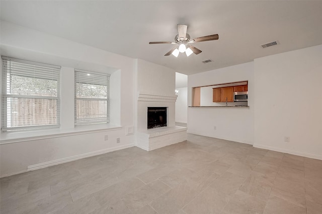 12419 Truesdell Dr, Houston, TX 77071 - unfurnished living room with a ceiling fan, a fireplace, and baseboards