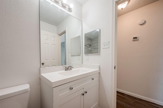 12419 Truesdell Dr, Houston, TX 77071 - bathroom with wood finished floors, vanity, toilet, and baseboards