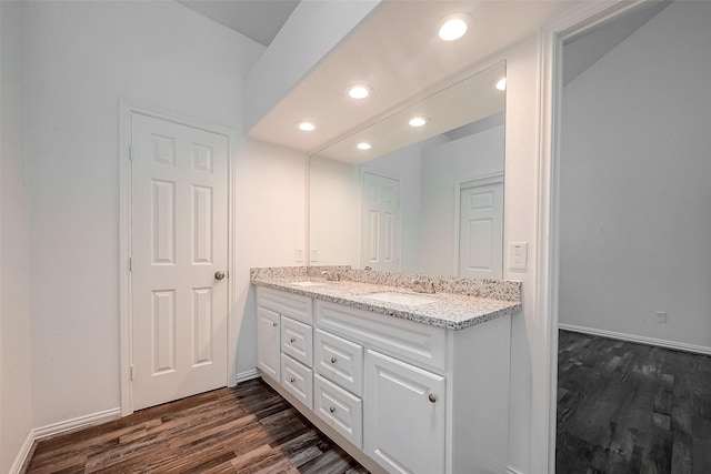 12419 Truesdell Dr, Houston, TX 77071 - bathroom with double vanity, wood finished floors, recessed lighting, and baseboards