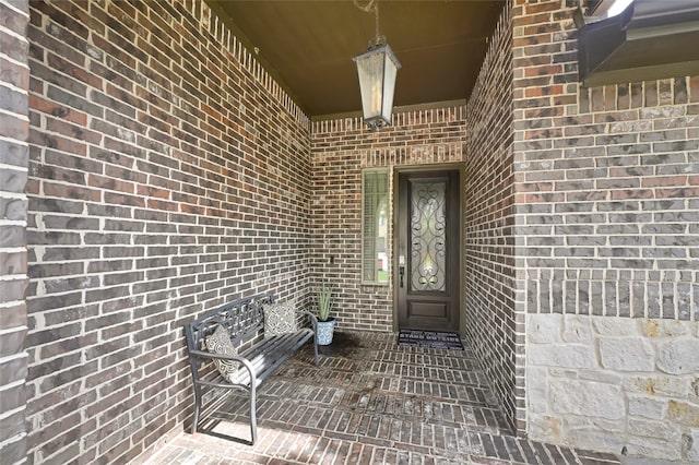 21115 Magnolia Hollow Ln, Richmond, TX 77407 - view of exterior entry featuring brick siding