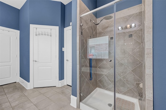 21115 Magnolia Hollow Ln, Richmond, TX 77407 - full bath featuring a shower stall, tile patterned flooring, and baseboards