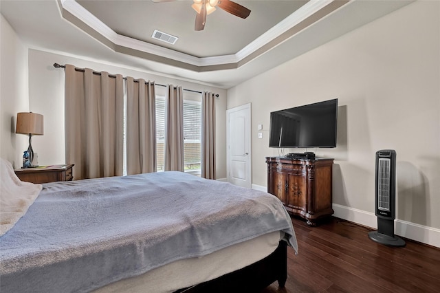 21115 Magnolia Hollow Ln, Richmond, TX 77407 - bedroom featuring a raised ceiling, hardwood / wood-style floors, ornamental molding, baseboards, and a ceiling fan