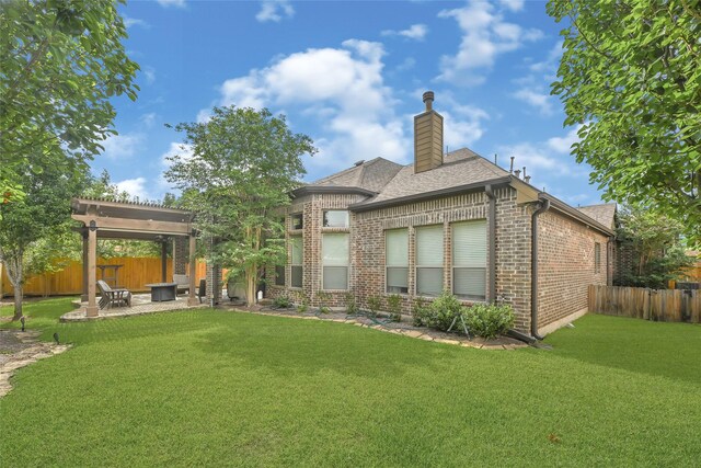21115 Magnolia Hollow Ln, Richmond, TX 77407 - rear view of house with brick siding, a patio, a chimney, and roof with shingles