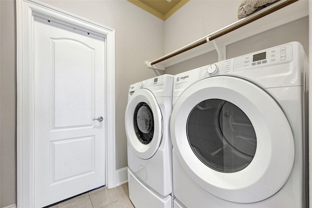 21115 Magnolia Hollow Ln, Richmond, TX 77407 - washroom with independent washer and dryer and light tile patterned floors