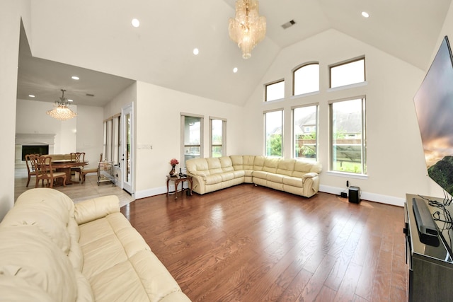 18111 Dockside Landing Dr, Cypress, TX 77433 - living room with a chandelier, healthy amount of natural light, recessed lighting, dark wood-type flooring, and high vaulted ceiling