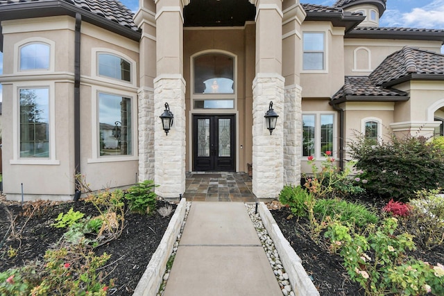 18111 Dockside Landing Dr, Cypress, TX 77433 - property entrance with stucco siding, french doors, and a tiled roof