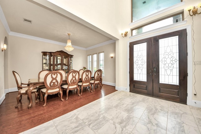 18111 Dockside Landing Dr, Cypress, TX 77433 - entryway featuring french doors, crown molding, baseboards, arched walkways, and marble look tiles