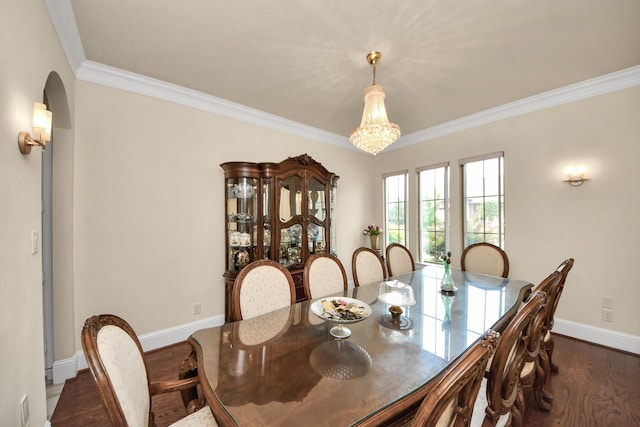 18111 Dockside Landing Dr, Cypress, TX 77433 - dining room with ornamental molding, baseboards, dark wood-style floors, a chandelier, and arched walkways