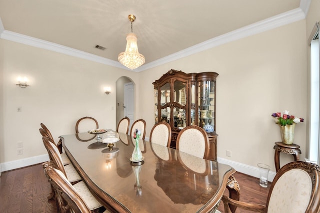 18111 Dockside Landing Dr, Cypress, TX 77433 - dining room with arched walkways, baseboards, dark wood-style floors, and crown molding