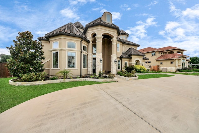 18111 Dockside Landing Dr, Cypress, TX 77433 - view of front of property with stucco siding, stone siding, curved driveway, and a tiled roof