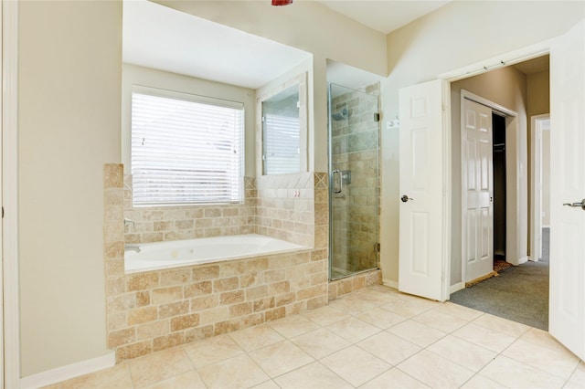 5208 Jolie Dr, Pearland, TX 77584 - bathroom featuring a bath, a stall shower, and tile patterned flooring