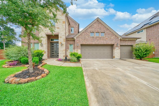 17107 Nulakeast Ct, Houston, TX 77044 - view of front of home with concrete driveway, a front lawn, a garage, and brick siding