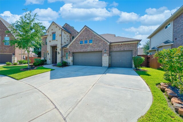 17107 Nulakeast Ct, Houston, TX 77044 - view of front facade with brick siding, driveway, and an attached garage
