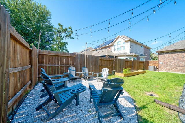 17107 Nulakeast Ct, Houston, TX 77044 - view of patio / terrace featuring an outdoor fire pit, cooling unit, and a vegetable garden