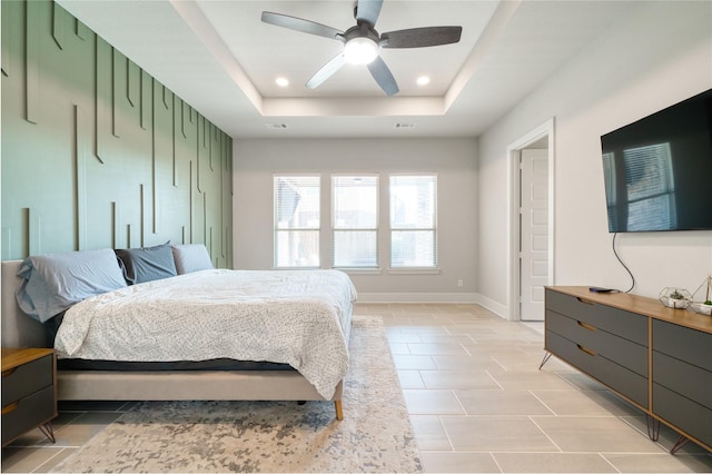 17107 Nulakeast Ct, Houston, TX 77044 - bedroom featuring a raised ceiling, recessed lighting, ceiling fan, baseboards, and light tile patterned floors