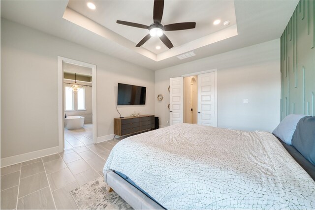 17107 Nulakeast Ct, Houston, TX 77044 - bedroom with a raised ceiling, baseboards, recessed lighting, ensuite bath, and ceiling fan