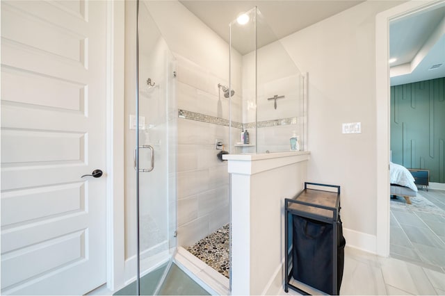 17107 Nulakeast Ct, Houston, TX 77044 - ensuite bathroom with a stall shower and baseboards