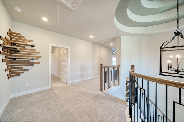 17107 Nulakeast Ct, Houston, TX 77044 - hallway featuring an upstairs landing, light carpet, a chandelier, baseboards, and attic access