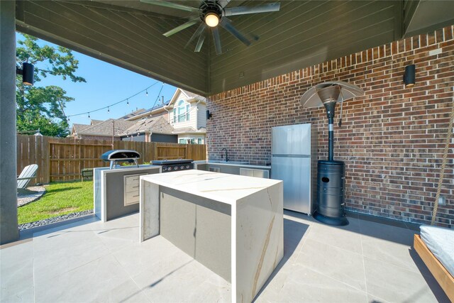17107 Nulakeast Ct, Houston, TX 77044 - view of patio / terrace with a ceiling fan and a sink