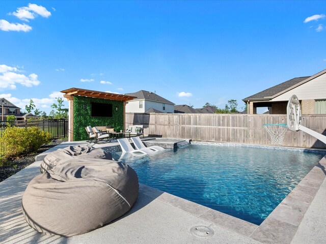9715 Migrant Hawker Ct, Conroe, TX 77385 - view of pool featuring a fenced backyard, a patio, and a jacuzzi