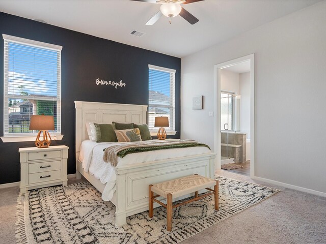 9715 Migrant Hawker Ct, Conroe, TX 77385 - bedroom with baseboards, light colored carpet, and ceiling fan