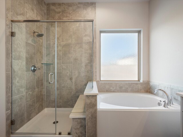 9715 Migrant Hawker Ct, Conroe, TX 77385 - bathroom with a bath and a shower stall