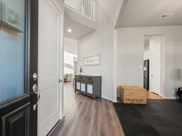 9715 Migrant Hawker Ct, Conroe, TX 77385 - foyer entrance with wood finished floors and baseboards