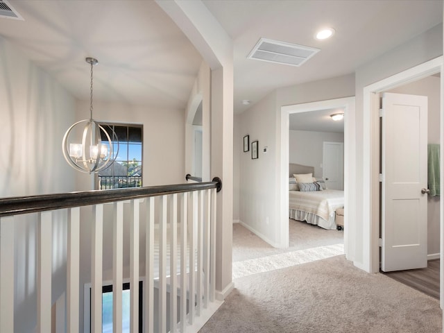 9715 Migrant Hawker Ct, Conroe, TX 77385 - hall featuring carpet, a chandelier, baseboards, arched walkways, and recessed lighting