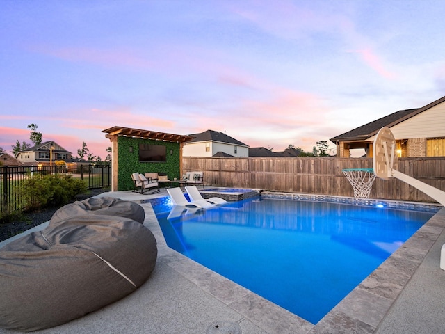 9715 Migrant Hawker Ct, Conroe, TX 77385 - view of pool with a pergola, a fenced backyard, a patio area, and a pool with connected hot tub