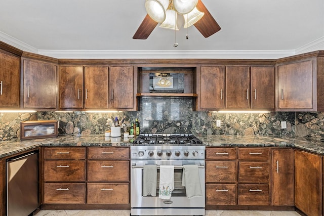 36 Lakeview Dr, Galveston, TX 77551 - kitchen featuring appliances with stainless steel finishes, dark stone countertops, backsplash, ceiling fan, and ornamental molding