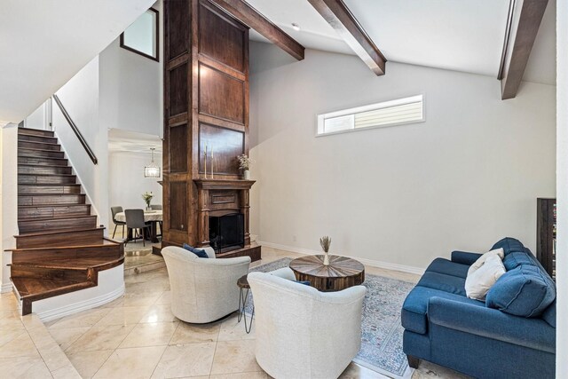 36 Lakeview Dr, Galveston, TX 77551 - living room featuring stairs, beamed ceiling, baseboards, a fireplace with raised hearth, and high vaulted ceiling