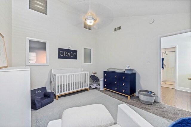 36 Lakeview Dr, Galveston, TX 77551 - bedroom with a nursery area, high vaulted ceiling, baseboards, and wood finished floors