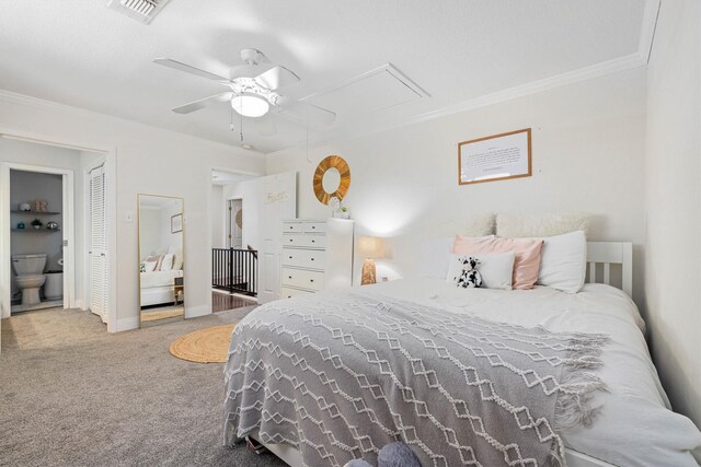 36 Lakeview Dr, Galveston, TX 77551 - carpeted bedroom with attic access, crown molding, ceiling fan, baseboards, and ensuite bath