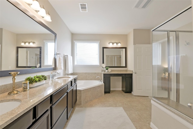 19538 Salt Grass Meadow Dr, Cypress, TX 77433 - full bath featuring double vanity, a garden tub, a stall shower, and tile patterned flooring