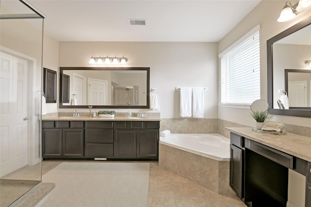 19538 Salt Grass Meadow Dr, Cypress, TX 77433 - full bath with double vanity, a bath, tile patterned floors, and a shower with door