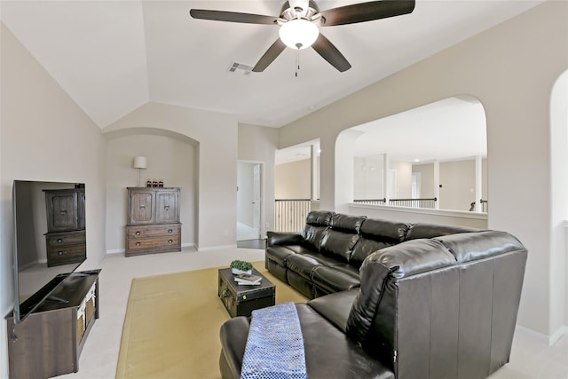 19538 Salt Grass Meadow Dr, Cypress, TX 77433 - living room with ceiling fan, baseboards, light colored carpet, and arched walkways