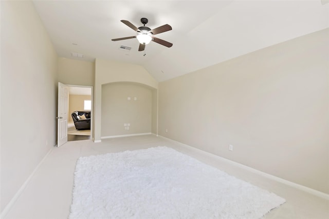 19538 Salt Grass Meadow Dr, Cypress, TX 77433 - spare room with light colored carpet, ceiling fan, vaulted ceiling, and baseboards