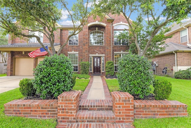 19538 Salt Grass Meadow Dr, Cypress, TX 77433 - traditional-style house featuring brick siding, concrete driveway, and an attached garage