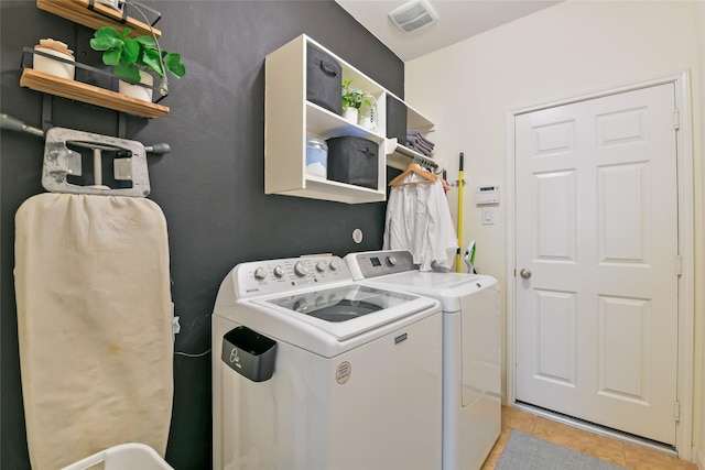 19538 Salt Grass Meadow Dr, Cypress, TX 77433 - washroom featuring washing machine and dryer and light tile patterned floors
