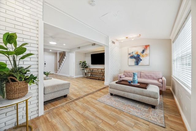 811 Lovett Blvd Unit 26, Houston, TX 77006 - living room featuring light wood-type flooring and stairs