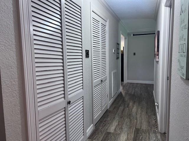 8594 Morgan Ln, Orange, TX 77632 - hallway with wood finished floors, crown molding, and baseboards